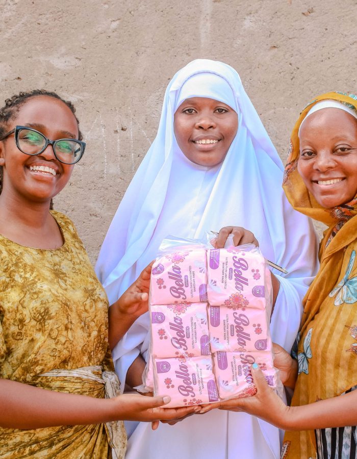 Distributing sanitary towels to teenage girls