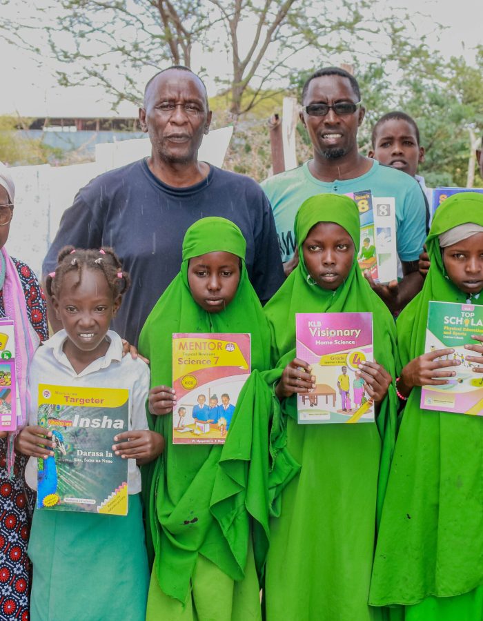 Distributing books to the local primary school